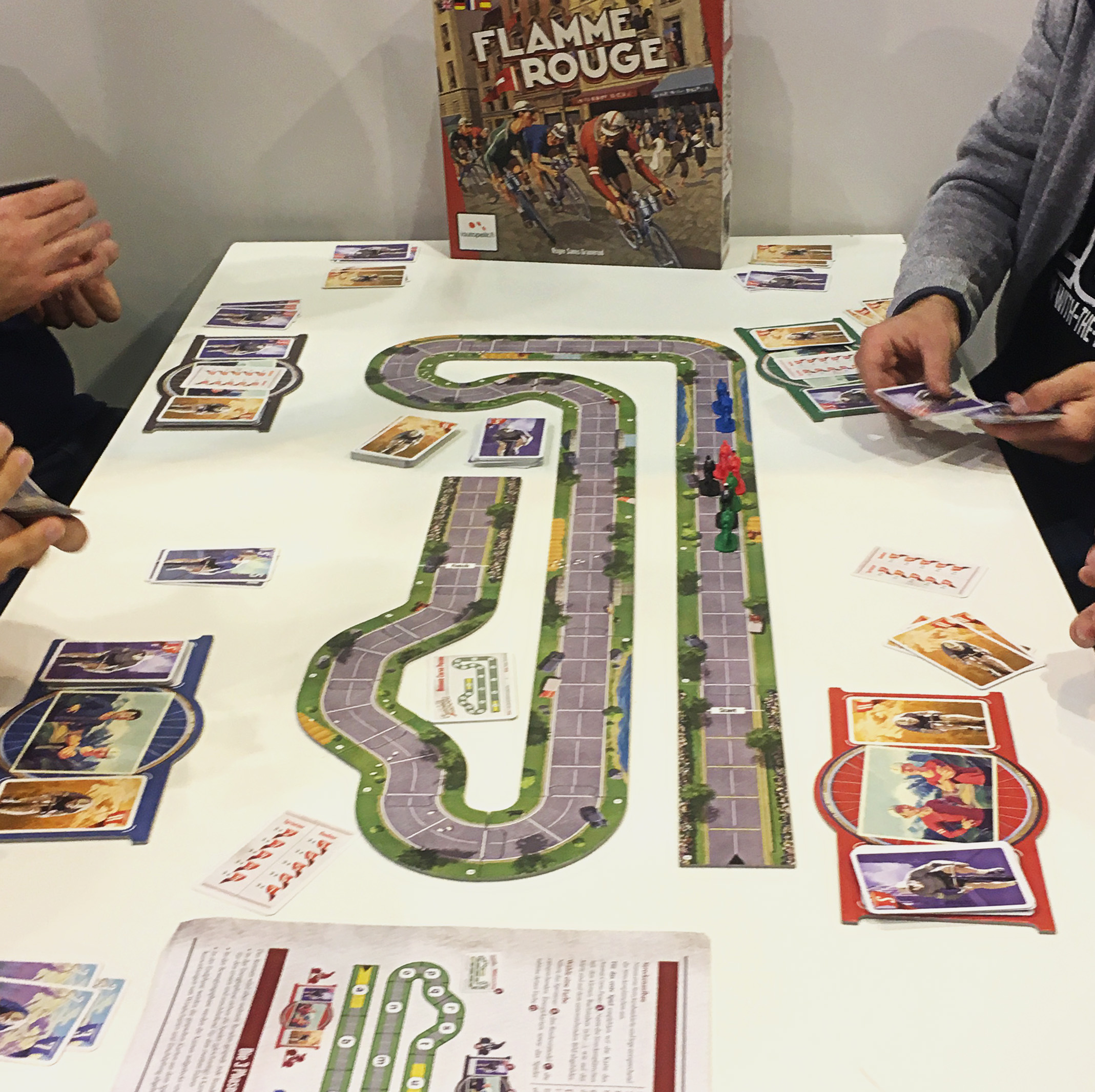 People playing La Flamme Rouge at Essen.